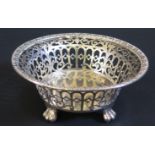 A George V Pierced Silver Bowl standing on four paw feet, London 1914, Blackmore & Fletcher Ltd.,