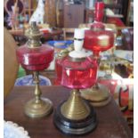 Three Cranberry Glass Lamp Bases, coloured glass side plates, Spode dinner plates etc.