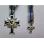 A Reproduction German Mother Cross with miniature dated 1938