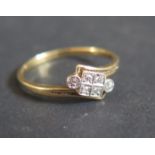 An 18ct Gold and Diamond Cross Over Ring, size J.5, 1.8g