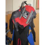 A Kite Surfing Da Kine Hawaii Load Equalizer Harness and two wet suits