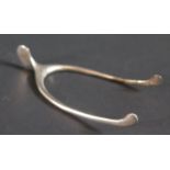 A pair of Sterling Silver Wishbone Spring Loaded Sugar Tongs by J.E. Caldwell Co, 16.2g