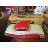 A Very Large Scale Marx Battery Operated Electric Tinplate Convertible Car in Red and Cream in