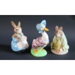 Three Beswick Beatrix Potter Figures: Mrs. Rabbit and Bunnies, Jemima Puddleduck and Samuel Whiskers
