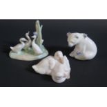 A Lladro Polar Bear and two Nao ornaments