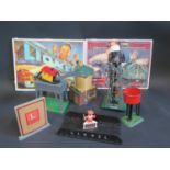 A Selection of O Gauge Buildings/Accessories and two reproduction Lionel Advertising Signs.