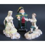 A Royal Doulton Dickens Bumble Figure and Royal Crown Derby Romeo and Juliet Ornaments by Edward