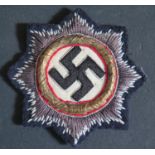A WWII Cloth German Cross in Gold 1941