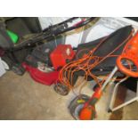 Mountfield Petrol Lawn Mower and red petrol can