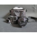 A Samsung NX1000 Mirrorless Digital Camera with 20-50mm Lens