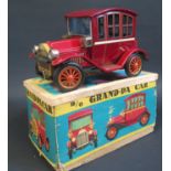 A TN Nomura Japan Battery Operated Tinplate Grand-Pa Car. Excellent (untested) in worn box.