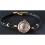A Lady's Omega 9ct Gold Wristwatch with leather strap and 9ct clasp, movement no. 19561698, running