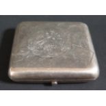 A Russian Silver Cigarette Case, the spring loaded cover decorated with a chased stylized