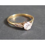 A Diamond Solitaire Engagement Ring in an 18ct Yellow Gold and Platinum Setting, size M, 2.1g