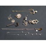 A Box of Odd Costume Jewellery including an early steel football pendant, risqué cigar cutter etc.