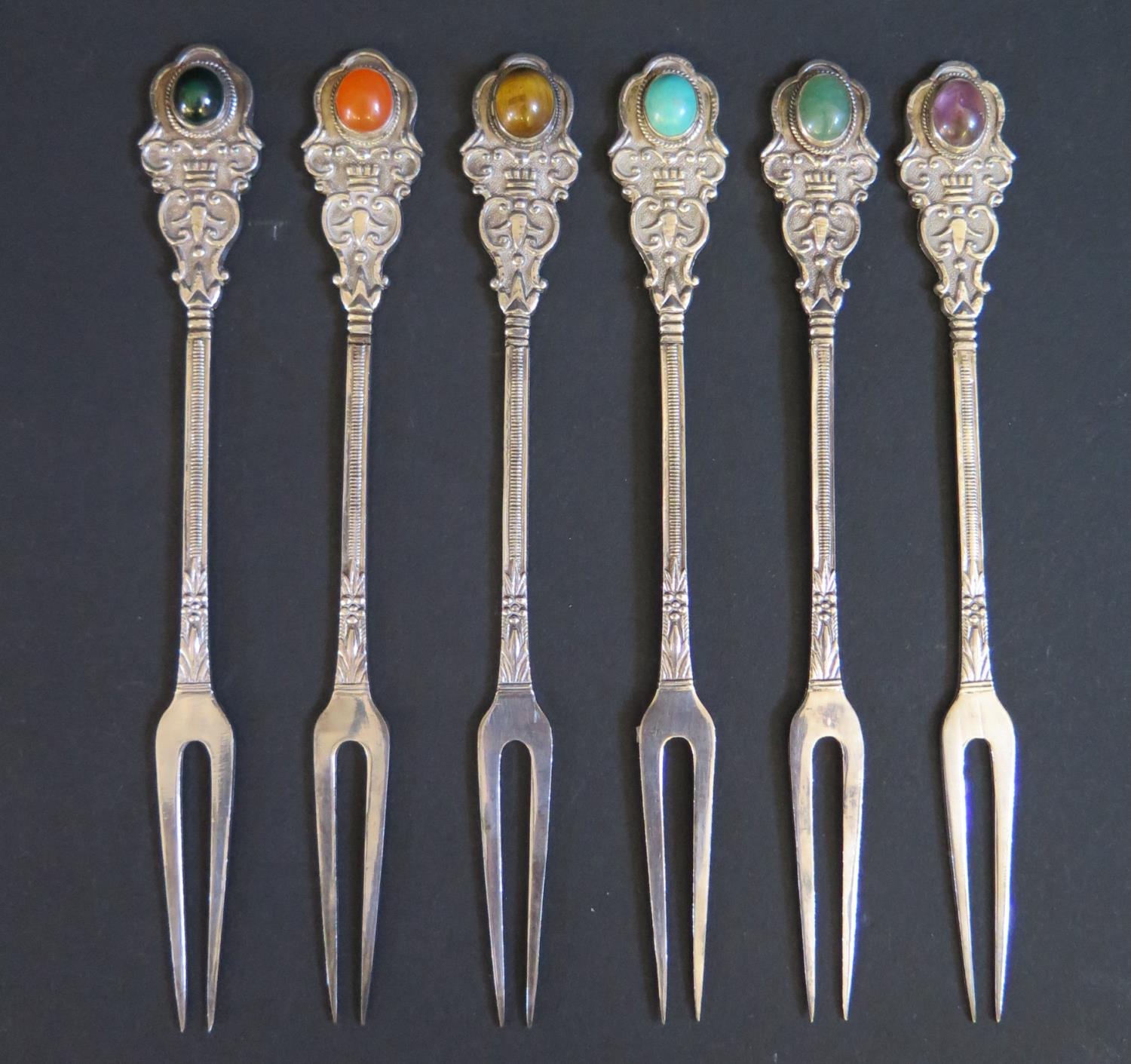 A Set of Six Silver Pickle Forks mounted with semi-precious stones, 77g gross