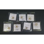 A Collection of Seven Great British Coin Replicas with COAs, .585 0.5g x 7