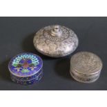 A Squat Foreign Silver Flask with foliate decoration (7.5cm diam.) and two foreign silver boxes,