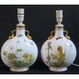 A Pair of Porcelain Moon Flasks decorated with chicks, flowers and other wildlife, converted to