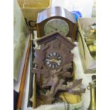 A Black Forest Cuckoo Clock and oak mantle clock