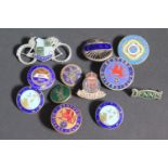A Collection of Enamel Brooches and Buttons including cycling and driving