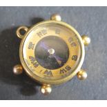 A 9ct Gold Mounted Compass Charm, 2.3g gross