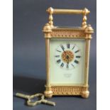 A Small Gilt Brass Carriage Clock, the dial signed H.W. BEDFORD 67 REGENT ST. LONDON, with key, 12.