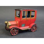 A Japanese Modern Toys Tinplate Clockwork Veteran Car (untested).