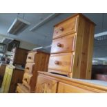 A Pine Chest of Drawers, pair of bedside chests and one other unit