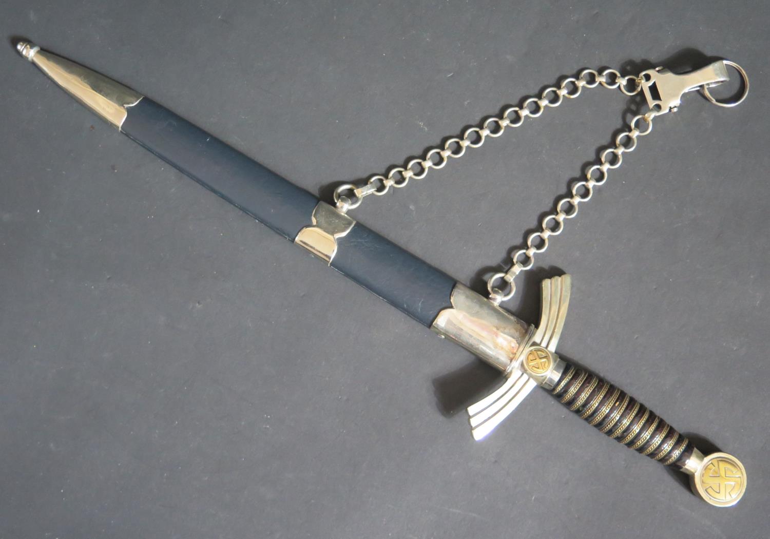 A German 1934 1st Pattern Luftwaffe Dagger with scabbard and hanger, blade marked ALSCOSO