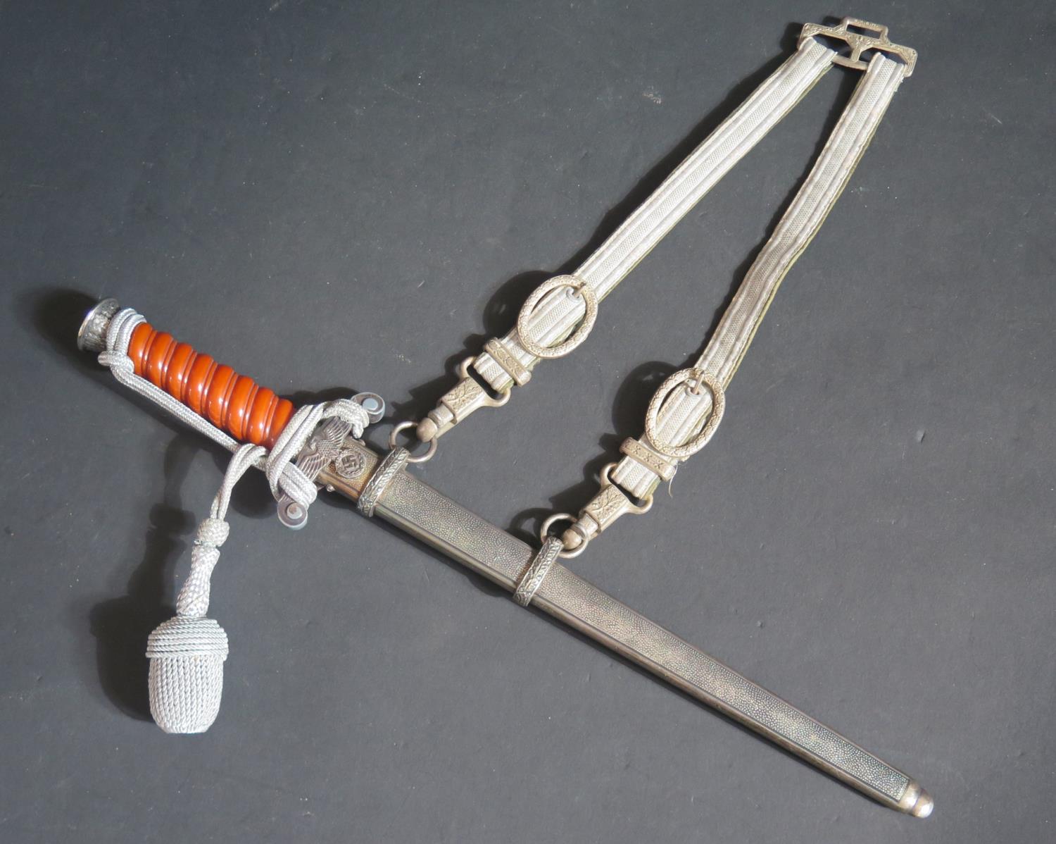 A WWII German Army Dagger with scabbard and hanging straps, blade marked TIGER