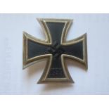 A WWII German 3rd Reich Iron Cross 1st Class (vaulted), pin stamped 65, boxed