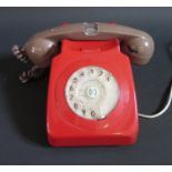 A Red Telephone with brown hand set