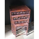 A Chinese Rosewood Nest of Three Tables with carved and pierced foliate apron and stylised bamboo