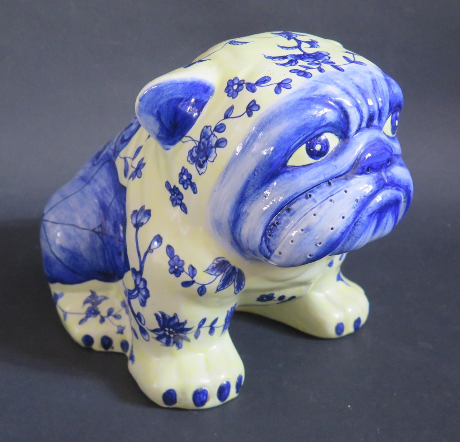 A Chinese Porcelain French Bulldog with foliate decoration