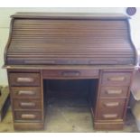 A 1930's Oak Roll Top Desk, 121cm wide