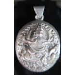 An Indian White Metal Locket, 50mm drop