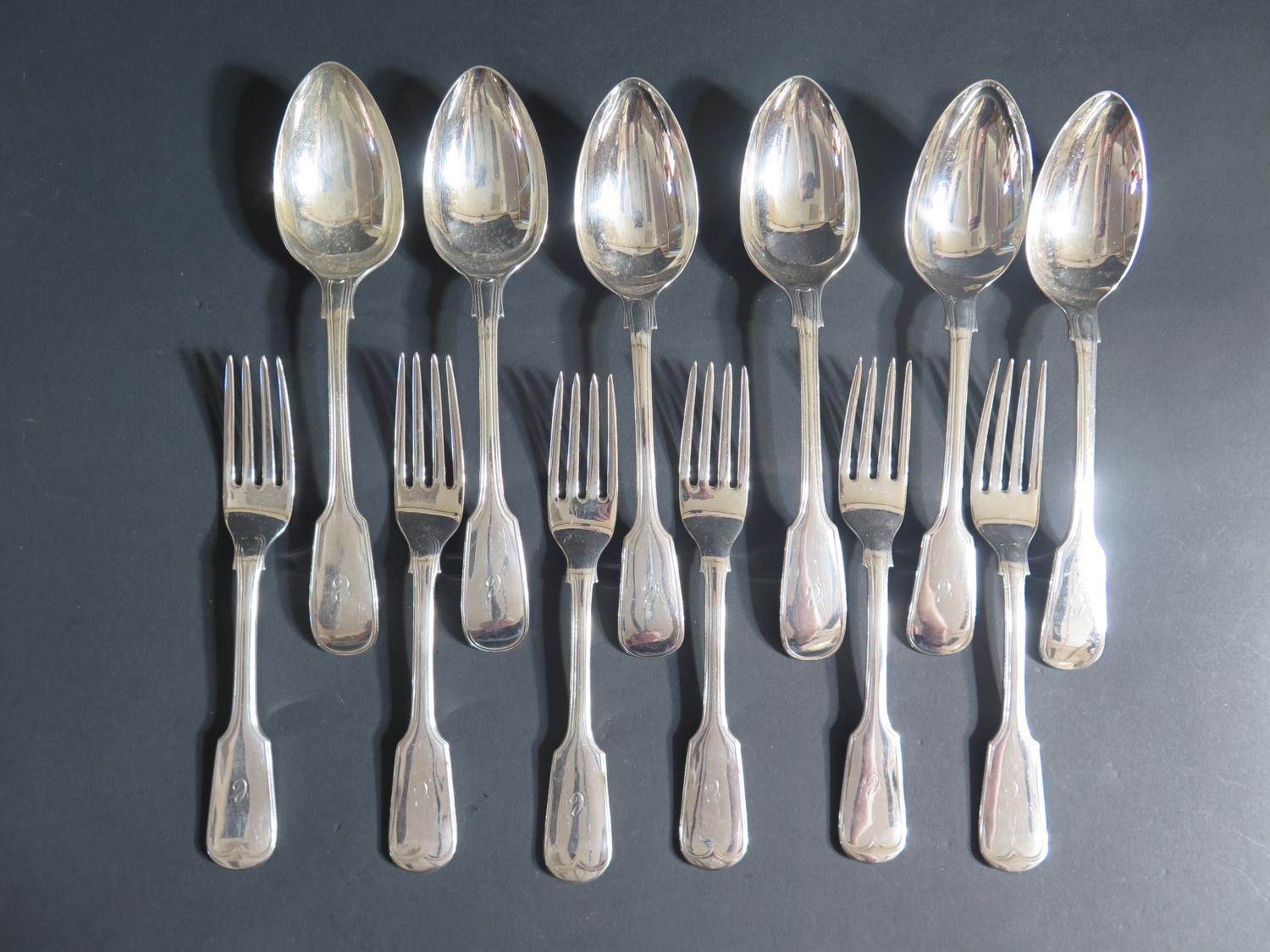 A Set of Six Silver Plated Serving Spoons and Forks