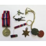 Two WWII Medals, dog tag and two aeroplane brooches