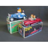 A Chinese made Tintoy Battery Operated ME630 Photoing Car and 'Old Style' Plastic Cartoon Car.