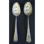 A Pair of George IV Silver Berry Spoons engraved with period griffin terminals and chased foliate