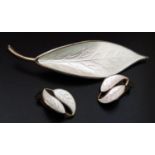 A Danish Sterling Silver and Enamel Leaf Brooch with matching clip earrings, stamped D-A and W in