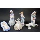 Six Lladro and Nao Figurines