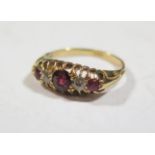 An 18ct Yellow Gold, Ruby and Diamond Five Stone Ring, size L.5, 3.7g