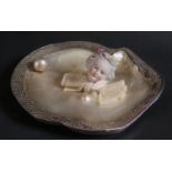 A Mother of Pearl Shell Dish mounted with a white metal border, pearl and ceramic head of a lady, c.