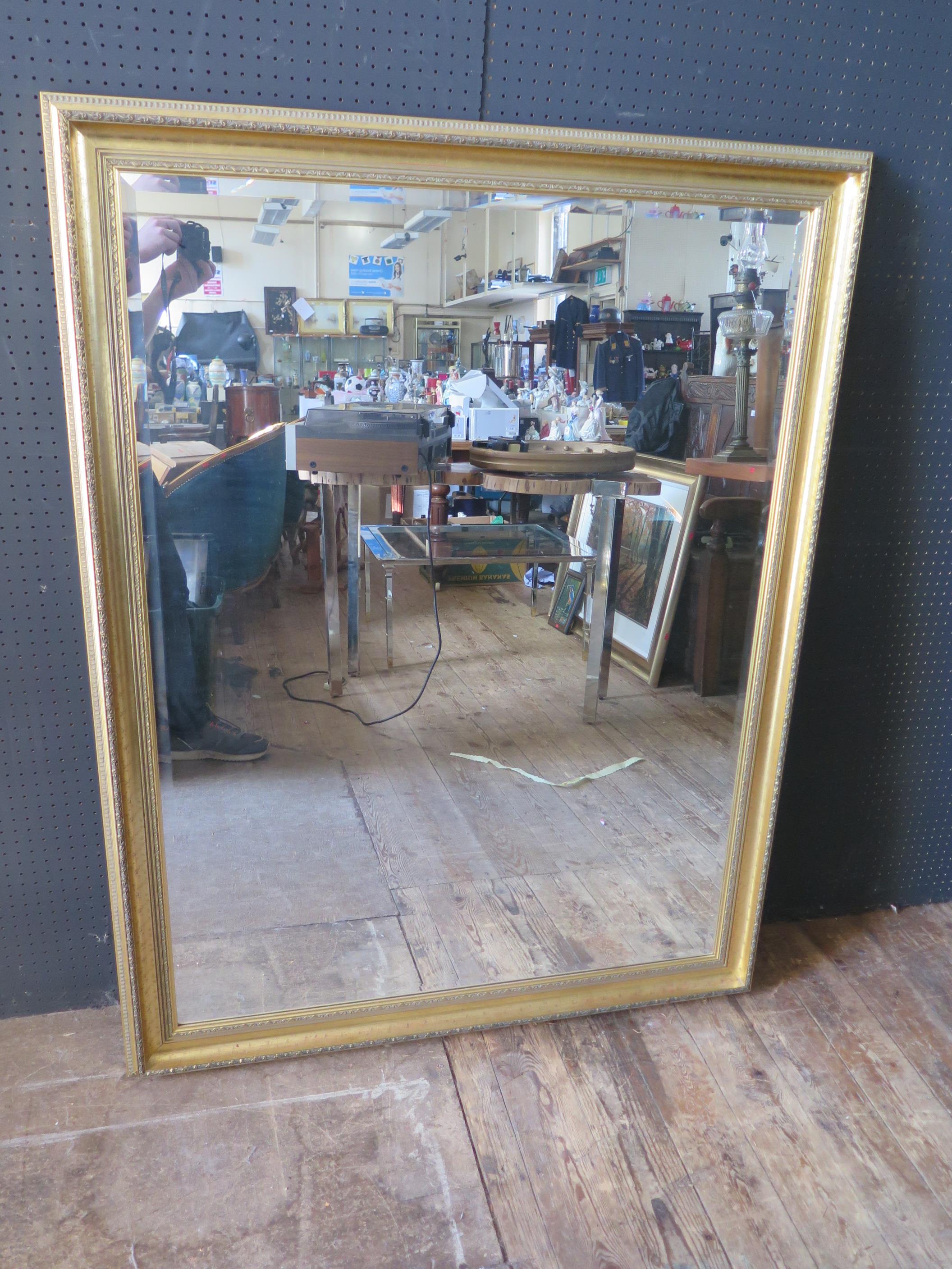 A Large Gilt Framed Bevel Edge Decorative Mirror, 106cm x 137cm