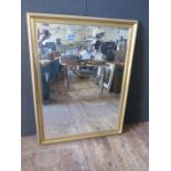 A Large Gilt Framed Bevel Edge Decorative Mirror, 106cm x 137cm