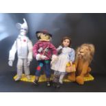 Four Wizard of Oz Figures on stands fixed into Four Sections of The Yellow Brick Road