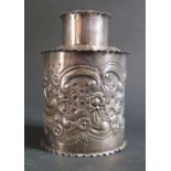 A Victorian Silver Teas Caddy with embossed flowering foliate scroll decoration, Birmingham 1898,