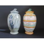 Two Poole Pottery Decorated Vases and Covers with shell finials, 28.5cm, boxed